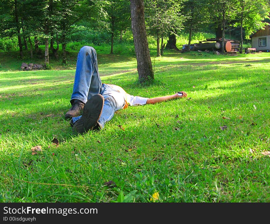 Boy lying ground grass field