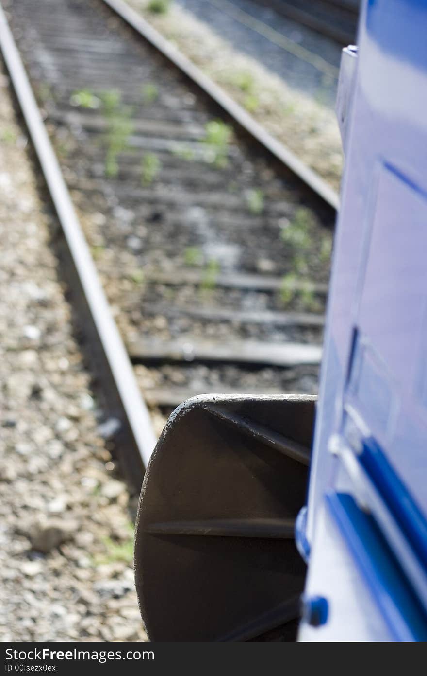 Blue train going ahead. Railroad view.