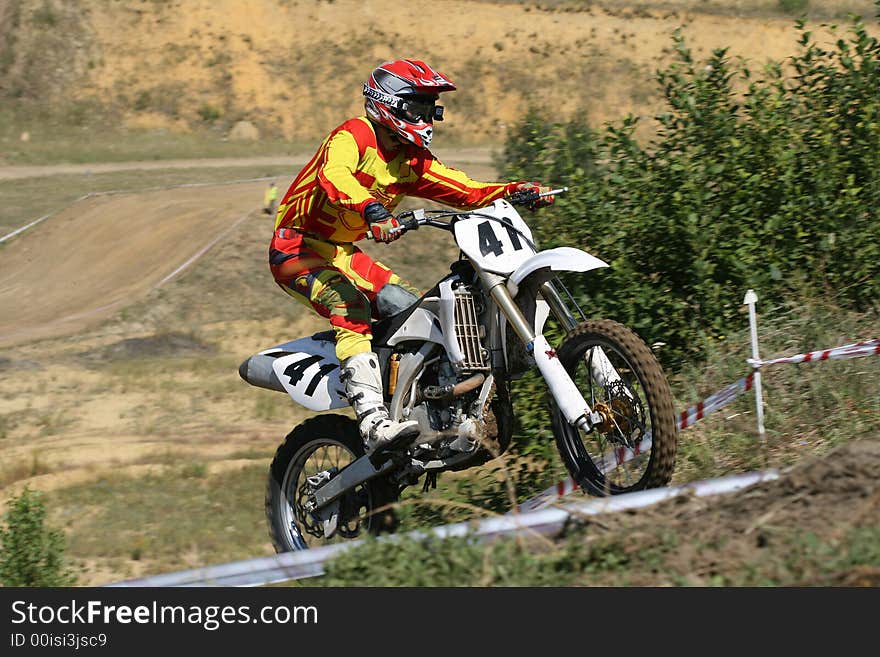 The sportsman on a motorcycle overcomes a steep slope. The sportsman on a motorcycle overcomes a steep slope