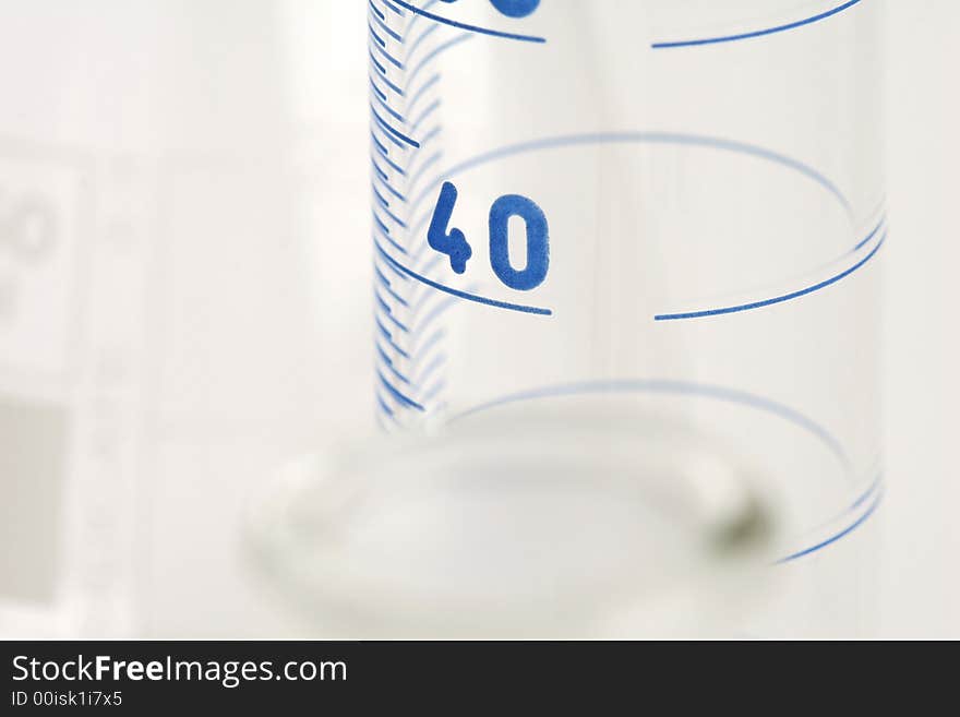 Detail of chemical glassware on a white background. Detail of chemical glassware on a white background