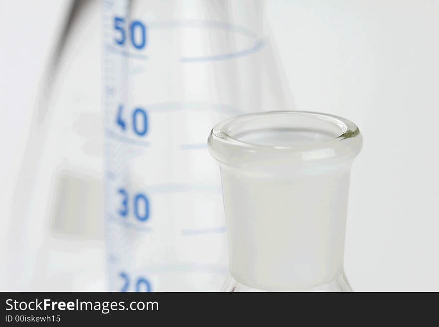 Detail of chemical glassware on a white background. Detail of chemical glassware on a white background