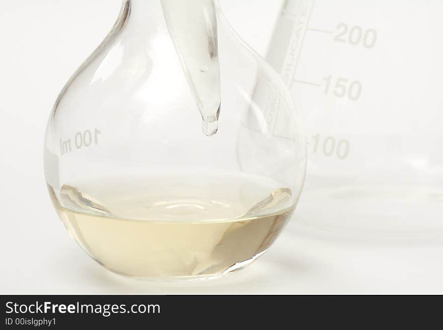 Detail of chemical glassware on a white background. Detail of chemical glassware on a white background