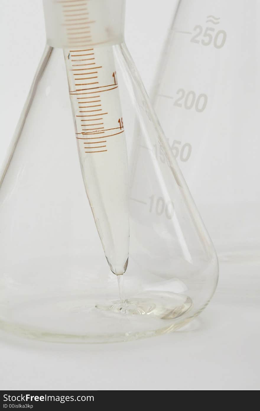 Detail of chemical glassware on a white background. Detail of chemical glassware on a white background