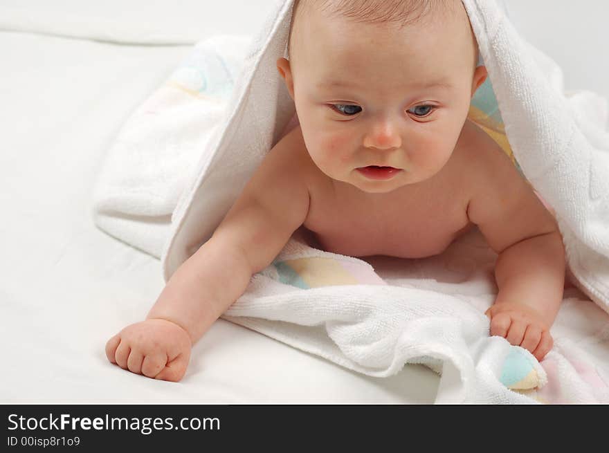 Sweet child under towel on white background. Sweet child under towel on white background