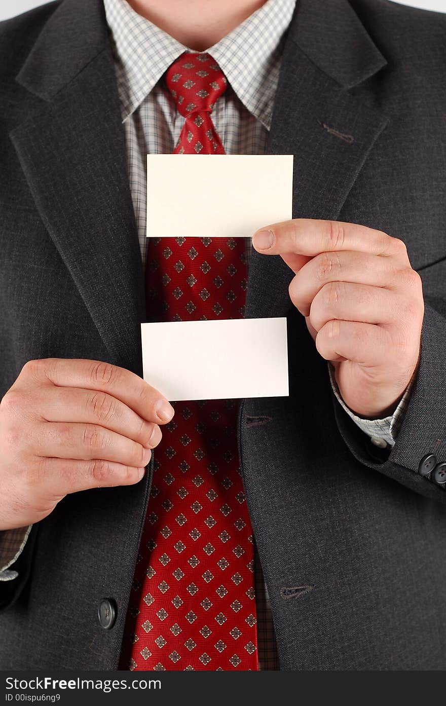 Businessman holding blank visiting cards. Businessman holding blank visiting cards