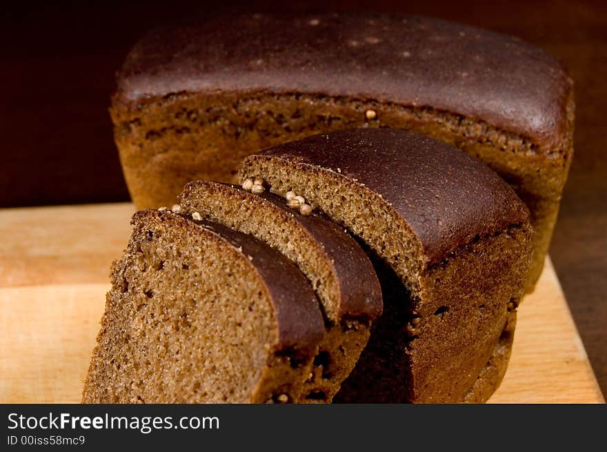 Pieces of rye bred on a table. Pieces of rye bred on a table