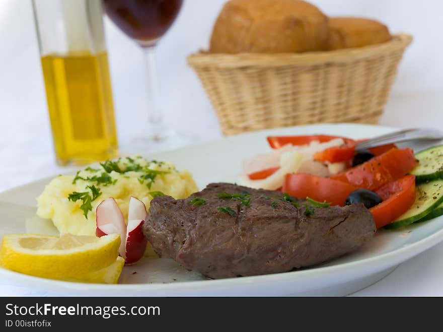 Steak medium with vegetable,salad,puree. Steak medium with vegetable,salad,puree.