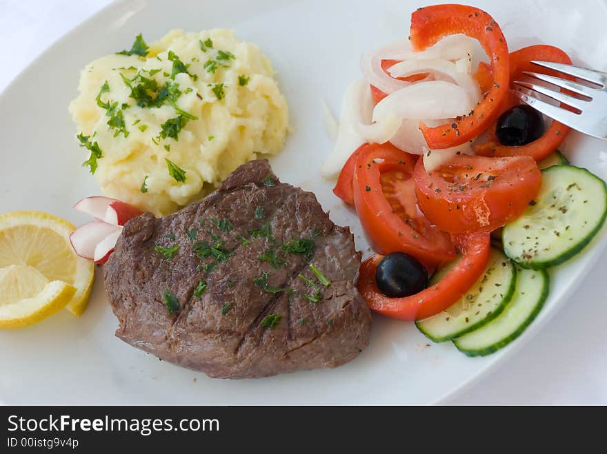 Steak medium with vegetable,salad,puree. Steak medium with vegetable,salad,puree.