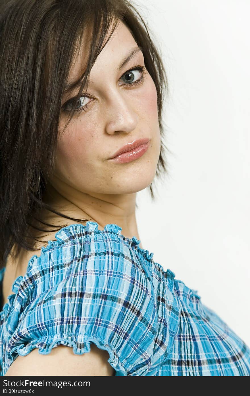 Beautiful young woman against a white background