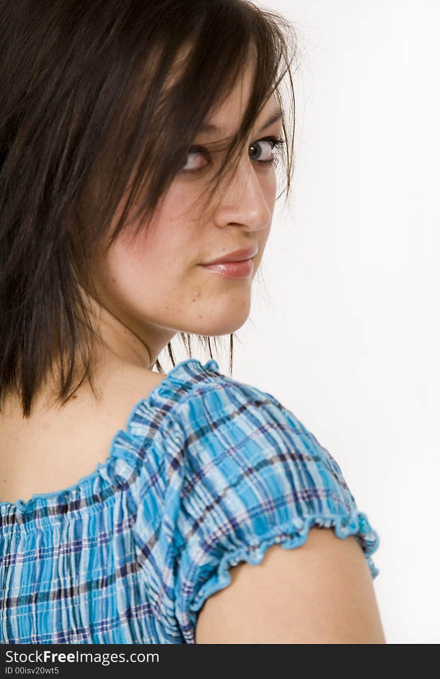 Beautiful young woman against a white background