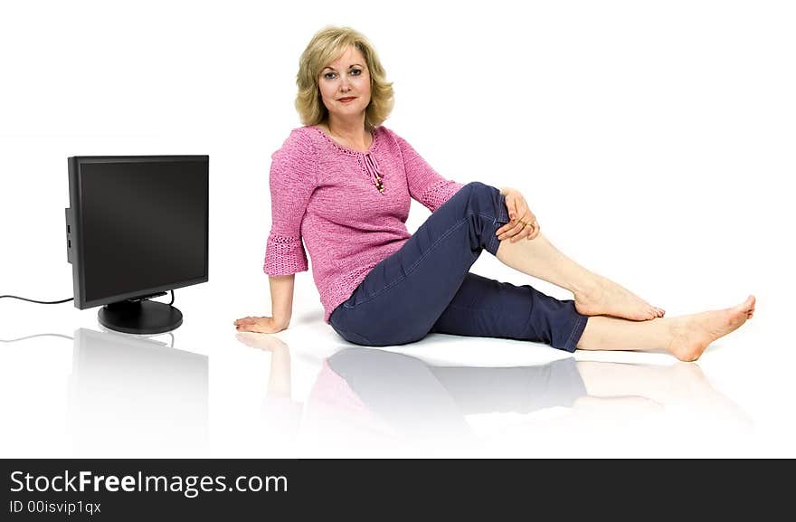 Beautiful middle-aged woman with a computer monitor. Beautiful middle-aged woman with a computer monitor