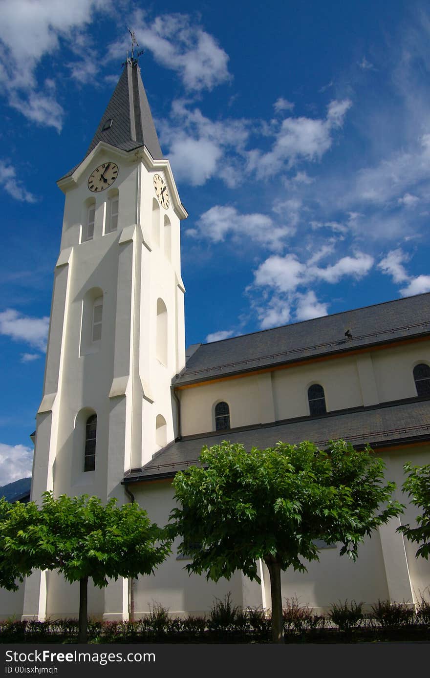 Modern protestant church with green trees around in blue sky. Modern protestant church with green trees around in blue sky