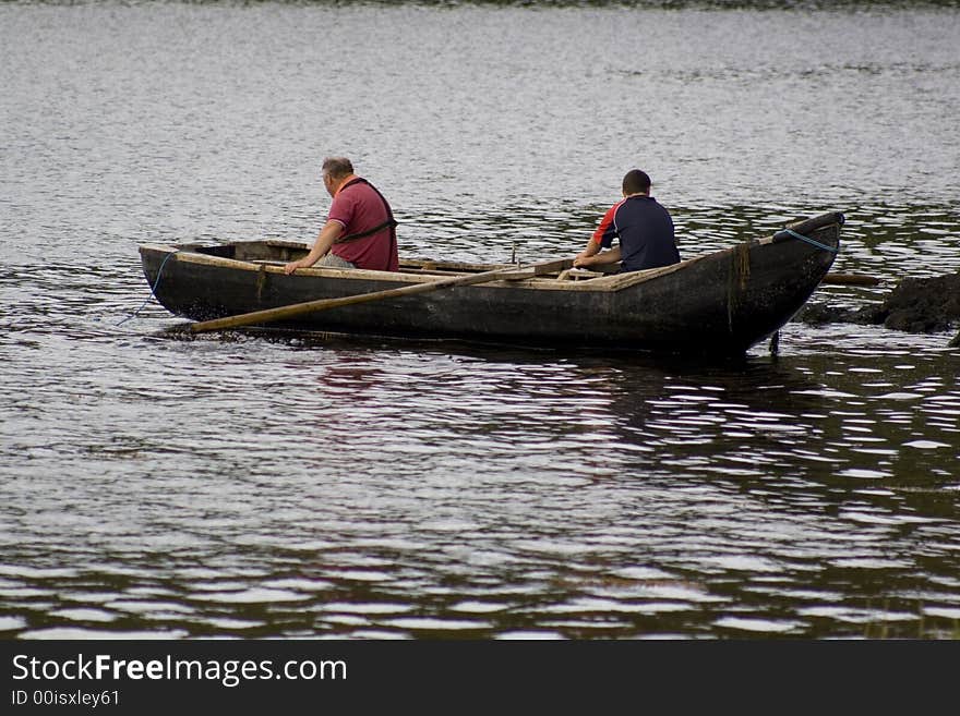 Irish Men Fishing In Currach