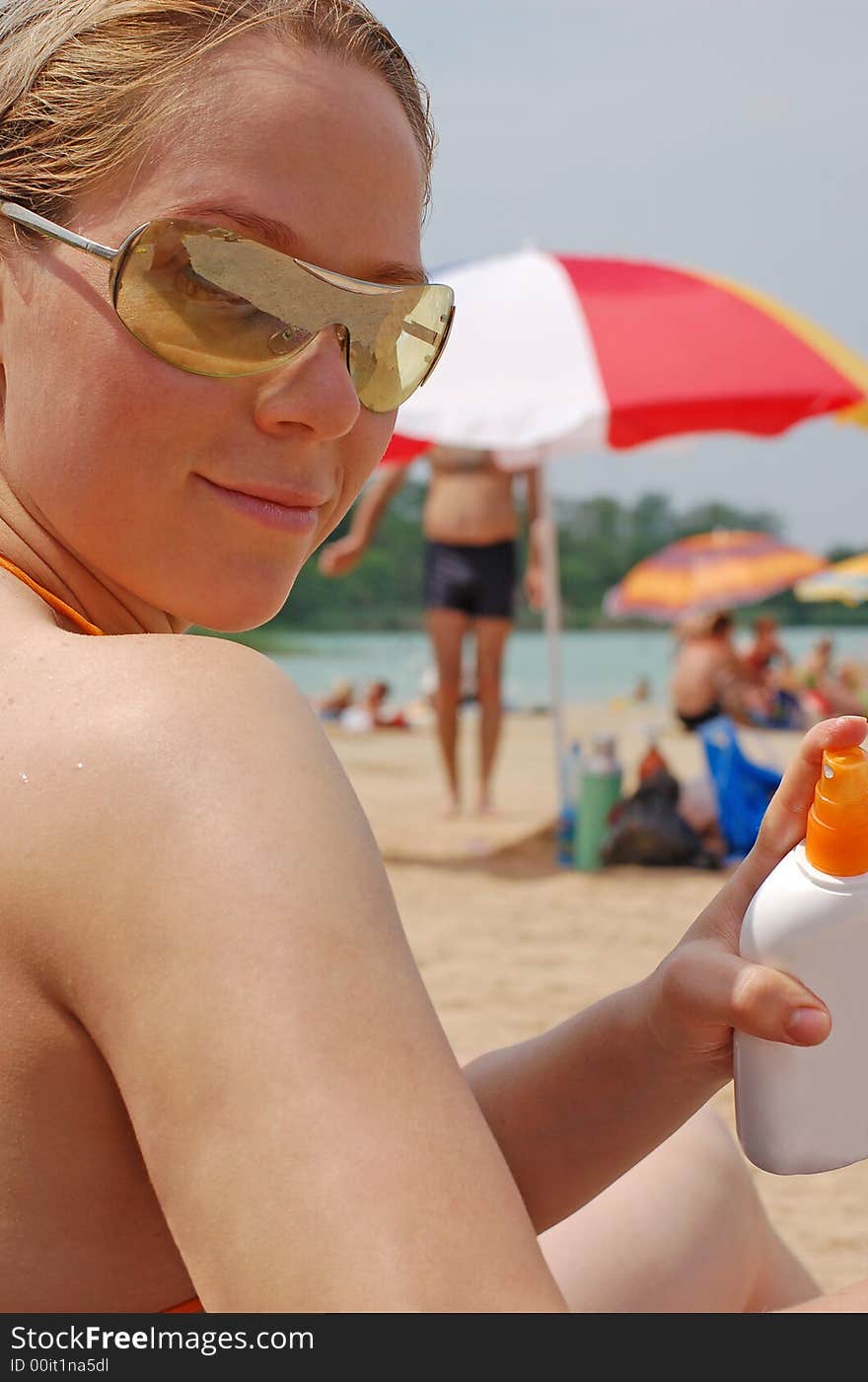 Woman holding sunscreen