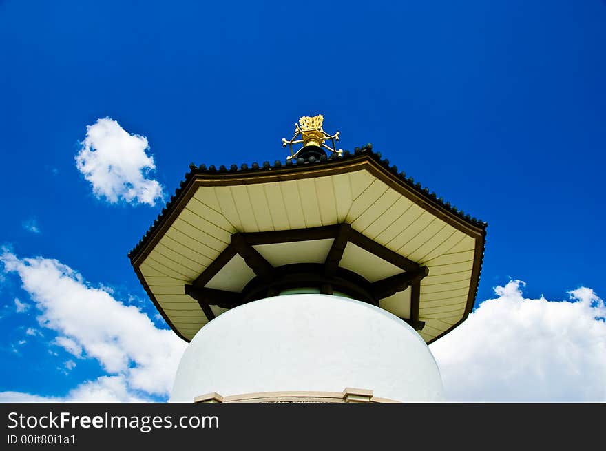 Buddhist peace pagoda against a blue sky