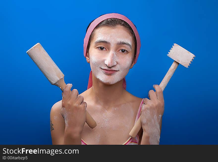 Kitchen utensils hands at the girl. Kitchen utensils hands at the girl