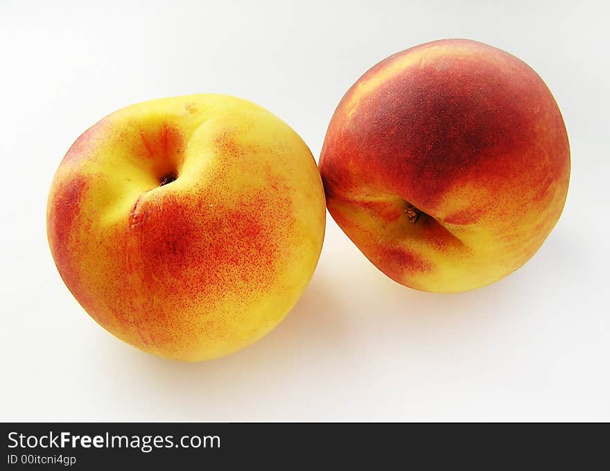 Fruit-piece. Two peaches. Tasty juicy orange fruits. Fruit-piece. Two peaches. Tasty juicy orange fruits.