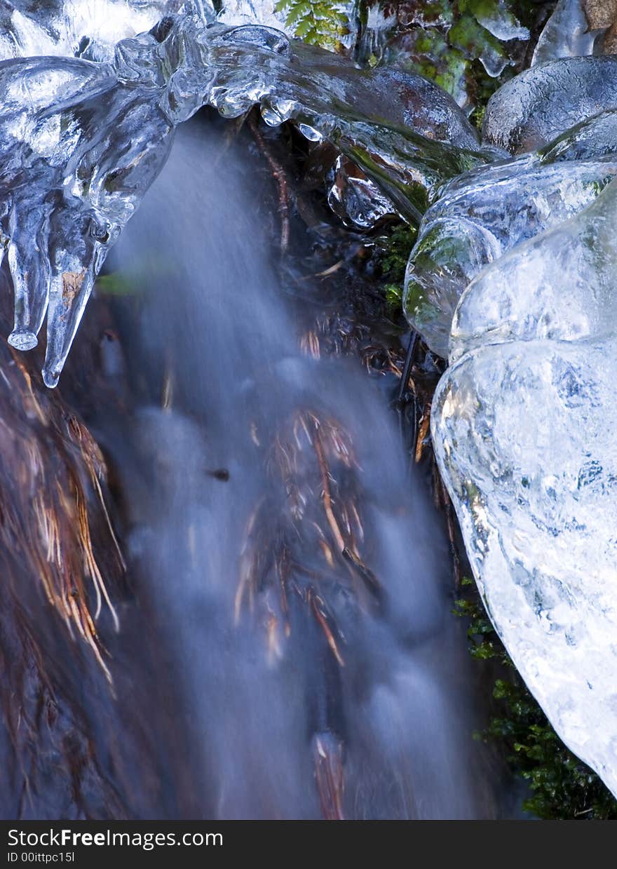 Detail of an ice encrusted waterfall, bluring the stream of water to give a more ethereal quality. Detail of an ice encrusted waterfall, bluring the stream of water to give a more ethereal quality