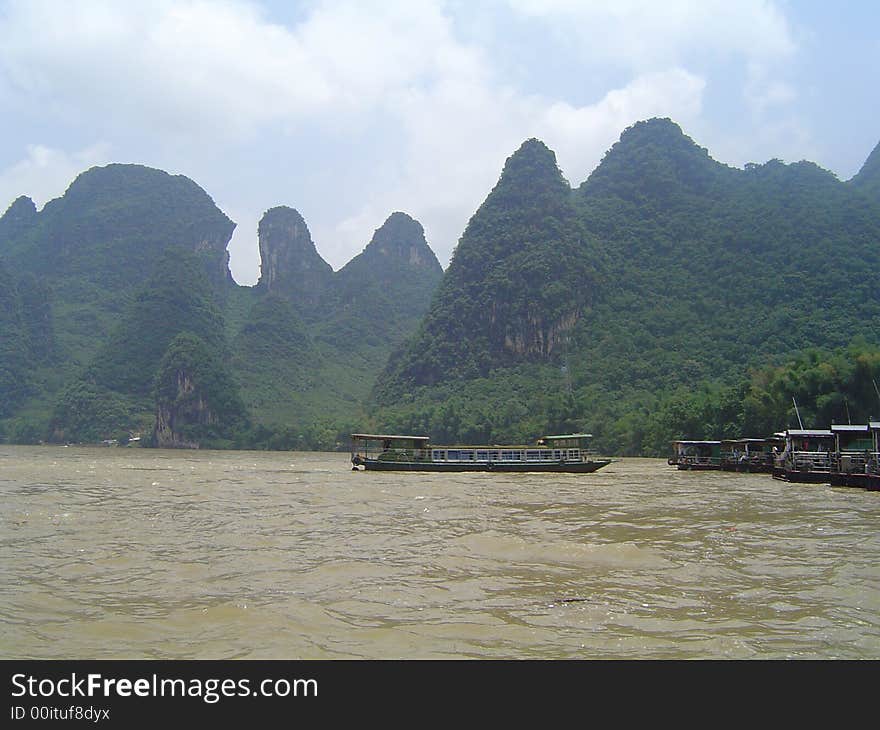 Mountains and river view from boat desk in china. Mountains and river view from boat desk in china