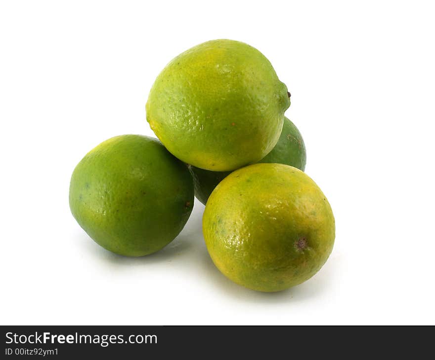 Four green limes on the white background. Four green limes on the white background