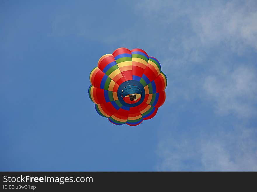 Hot Air Balloon Against a Cloudy Blue Sky