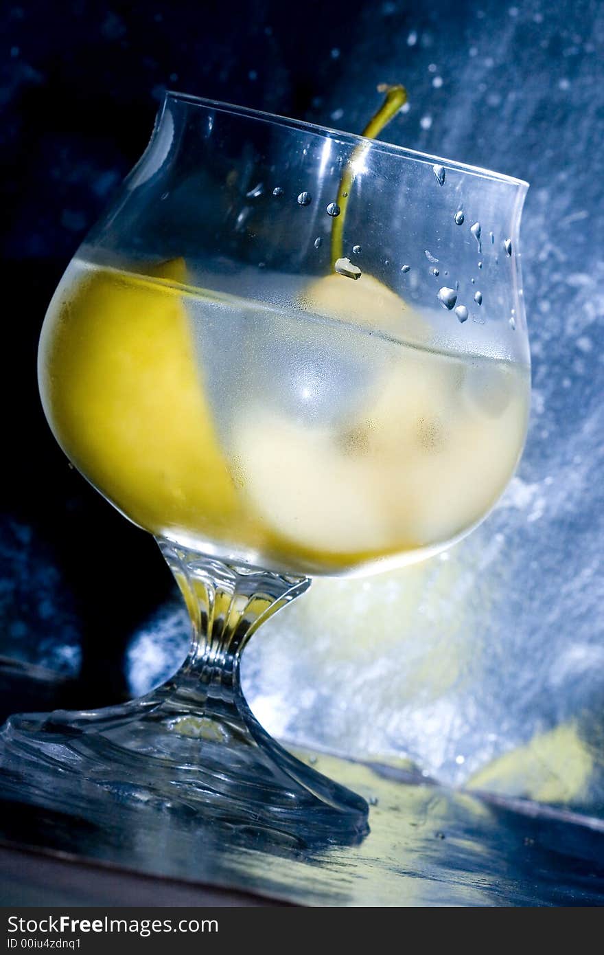 Pear in glass with martini and ice