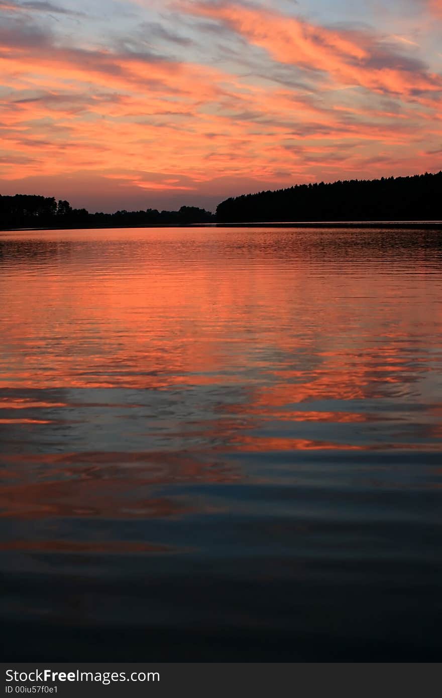 Sun setting  over the lake. Sun setting  over the lake