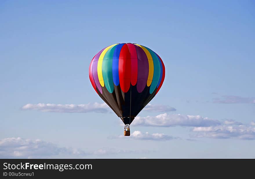 Hot Air Balloon Against a Cloudy Blue Sky