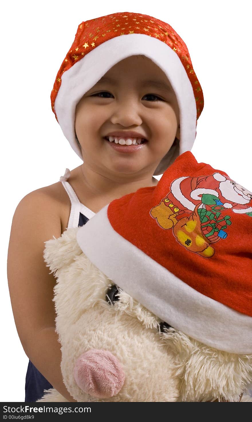 Young girl and teddy bear wearing santa hat. Young girl and teddy bear wearing santa hat