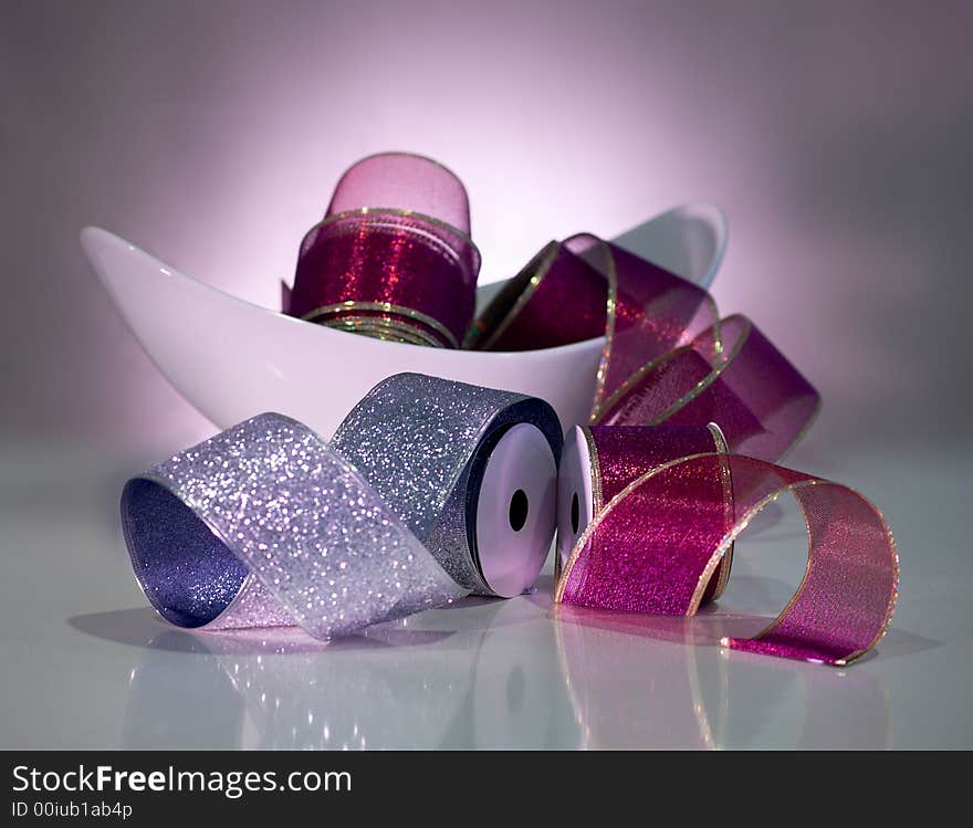 Bowl of ribbon on table setting with mood lighting