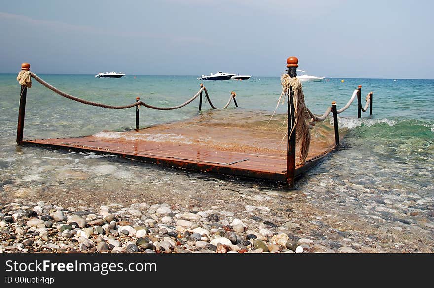 Wooden pier in the sea. Wooden pier in the sea