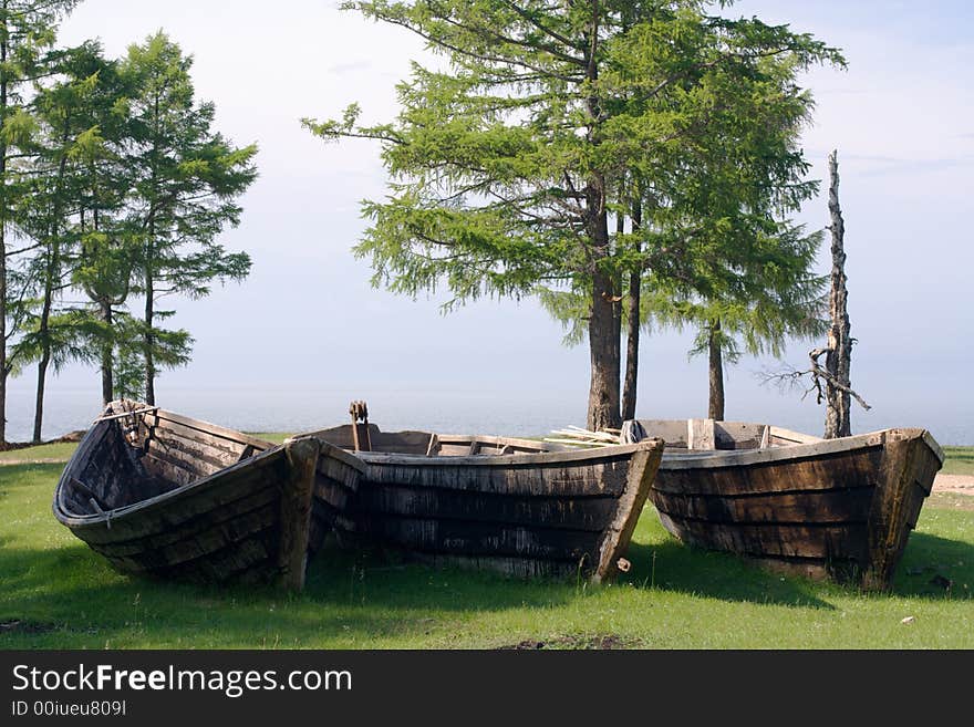 Old wooden fishing boats on the Baikal lakeside