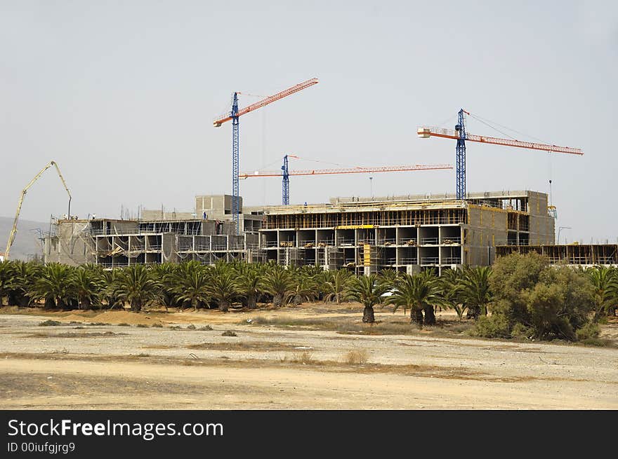 Workers are building a hotel. Workers are building a hotel.