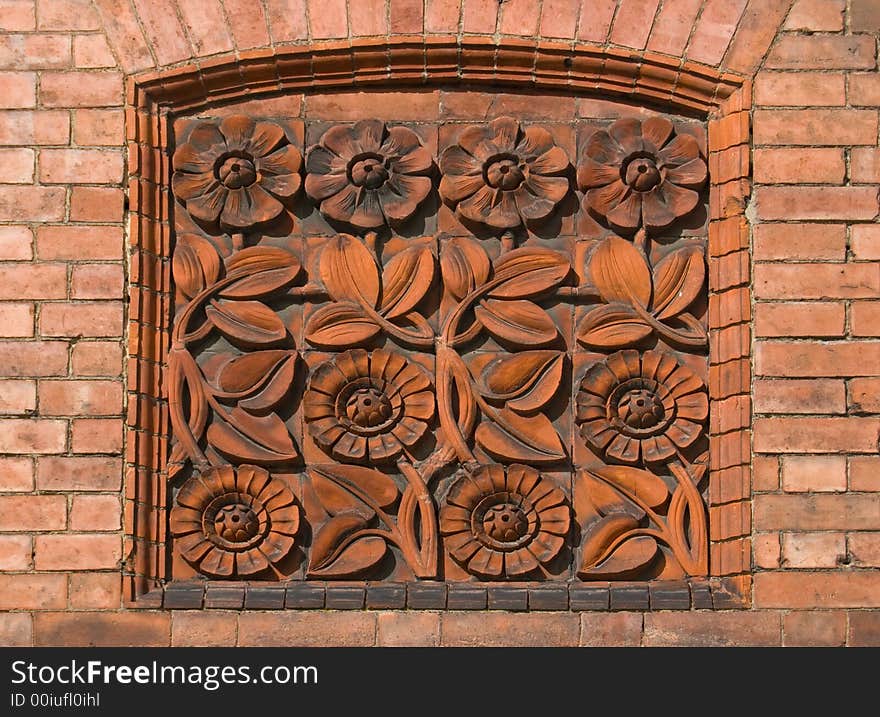 Attractive floral tiled plaque blocking up an old window