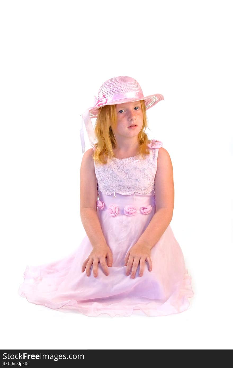 Girl sitting in pink dress