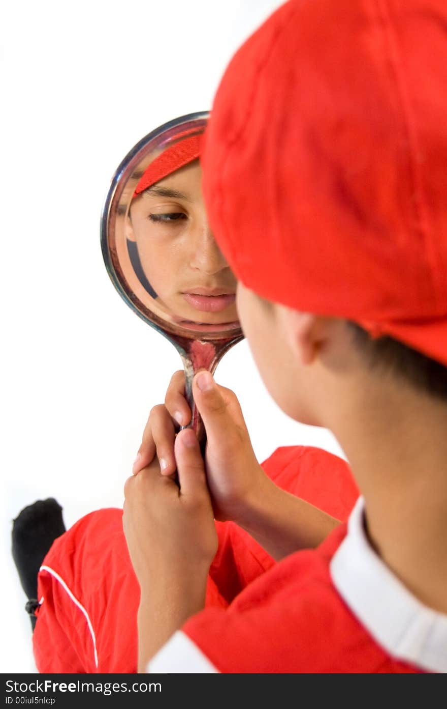 Young boy is watching himself in the mirror. Young boy is watching himself in the mirror