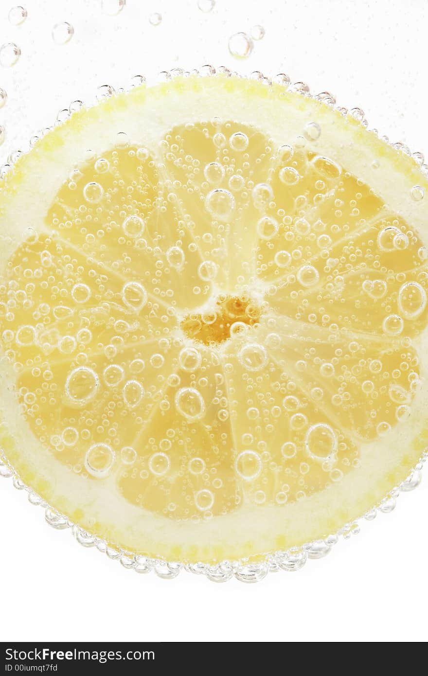 Lime slice on a bright white background whit water bubbles. Lime slice on a bright white background whit water bubbles