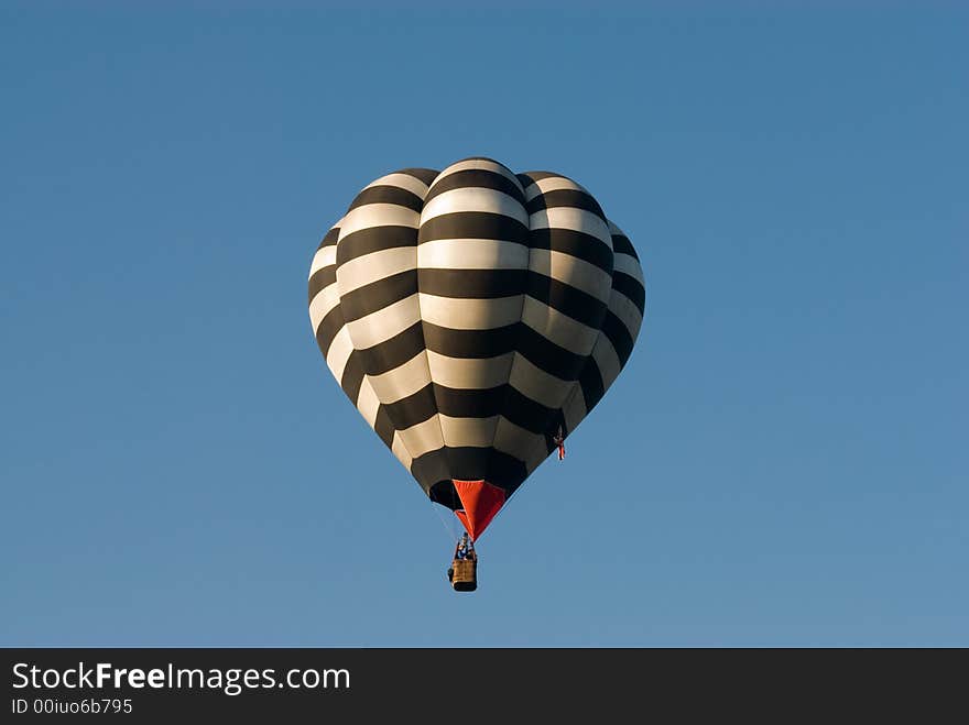 Hot air balloon in calm clear blue sky. Hot air balloon in calm clear blue sky