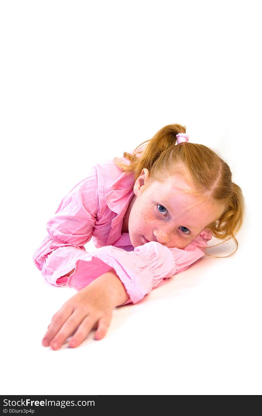 Young girl laying on floor