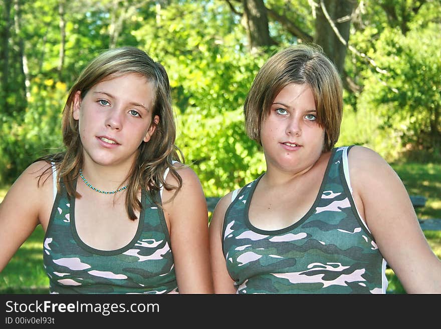 Two best friends wearing matching shirts. Two best friends wearing matching shirts