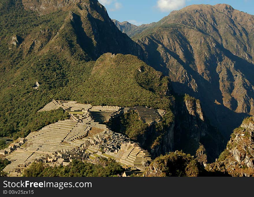 Ruins of Inca´s lost city Machu Picchu imbeeded in rough mountainscape. Ruins of Inca´s lost city Machu Picchu imbeeded in rough mountainscape