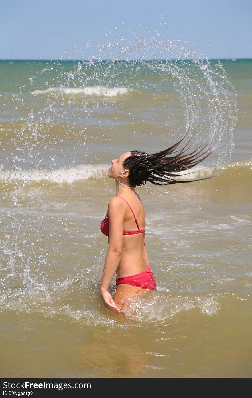 The woman stirs up a head in water