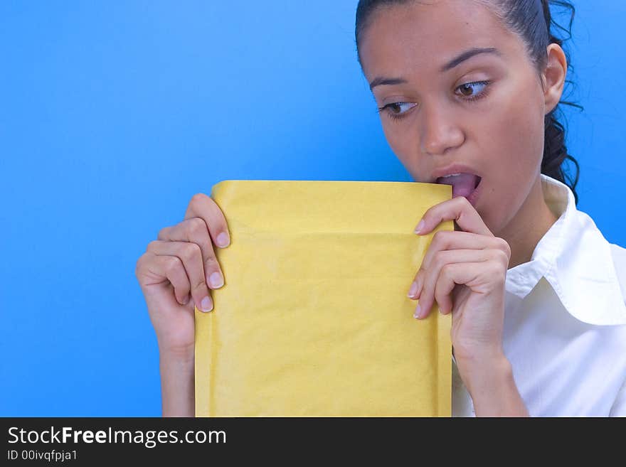 Beautiful girl holding envelope in her hands. Beautiful girl holding envelope in her hands