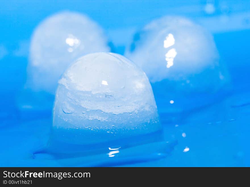 Ice cubes on a blue background