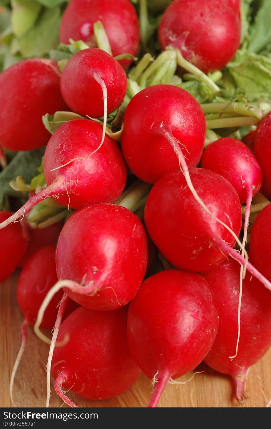 Radishes on a chopping board.