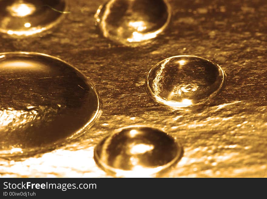 Golden water drop for background