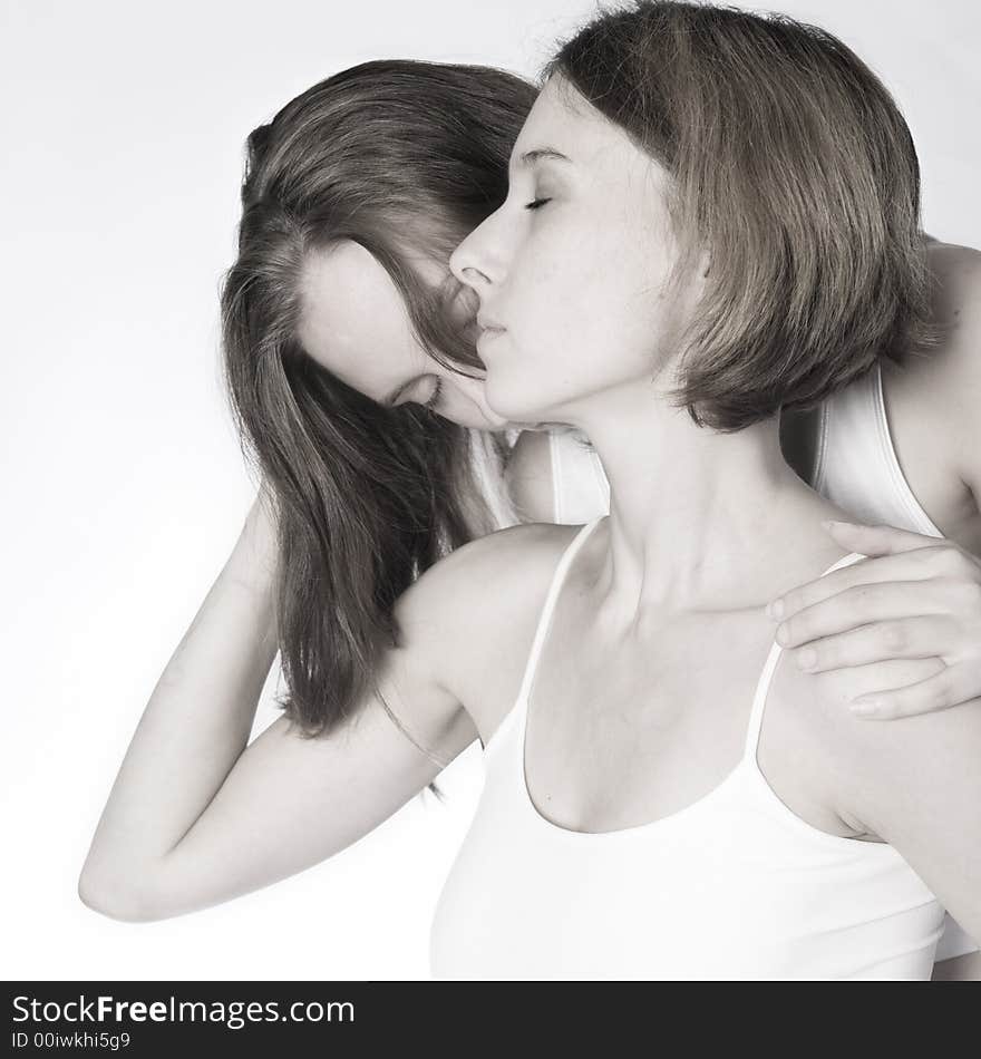 Two beauty girlfriends in lingerie in the photo studio. Two beauty girlfriends in lingerie in the photo studio