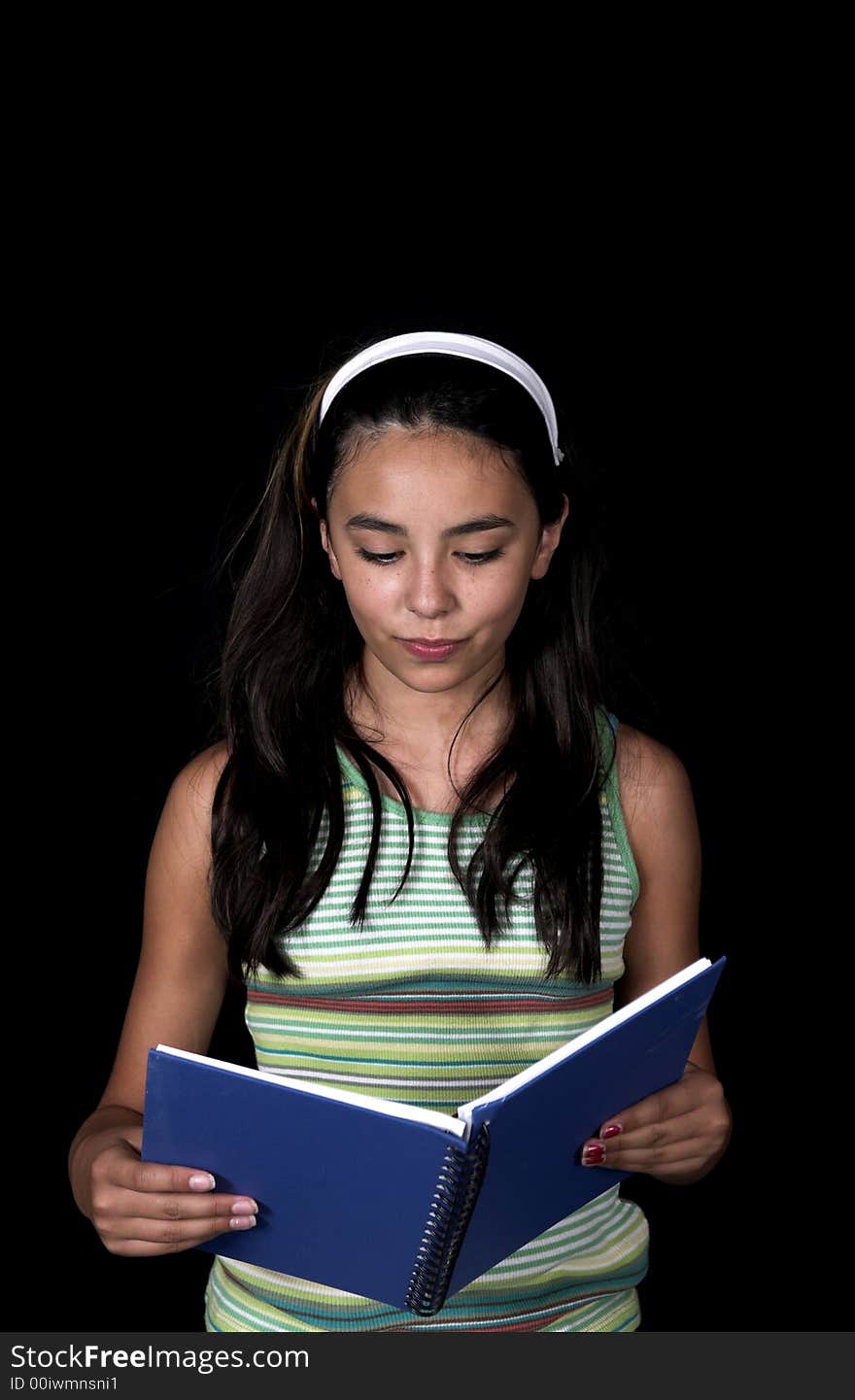 Girl posing for back to school theme over black background