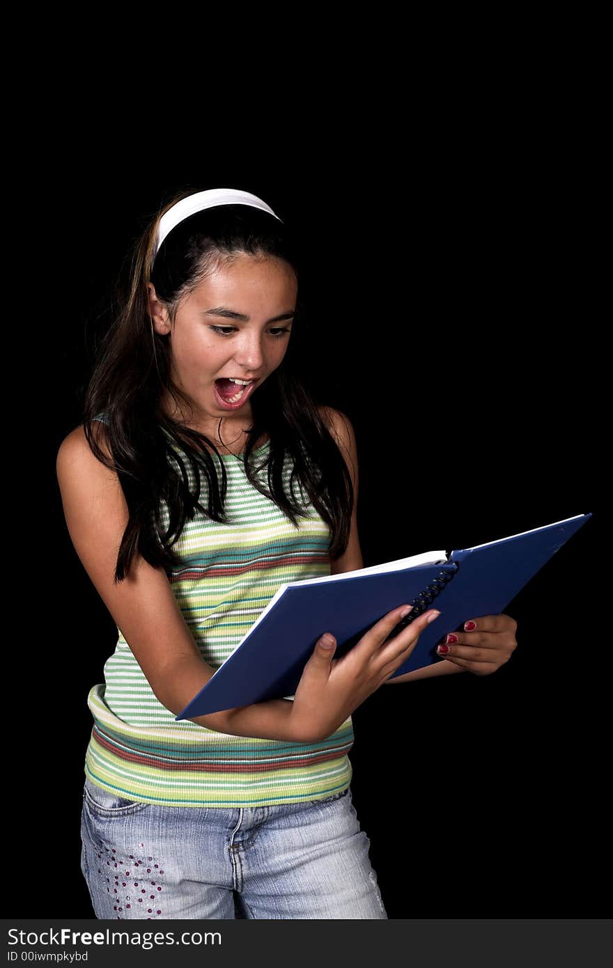 Girl posing for back to school theme over black background