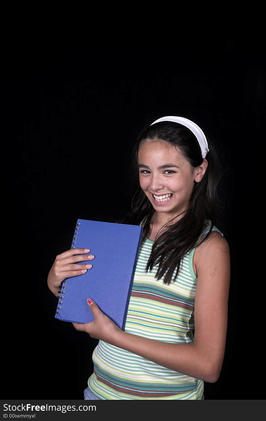 Girl posing for back to school theme over black background